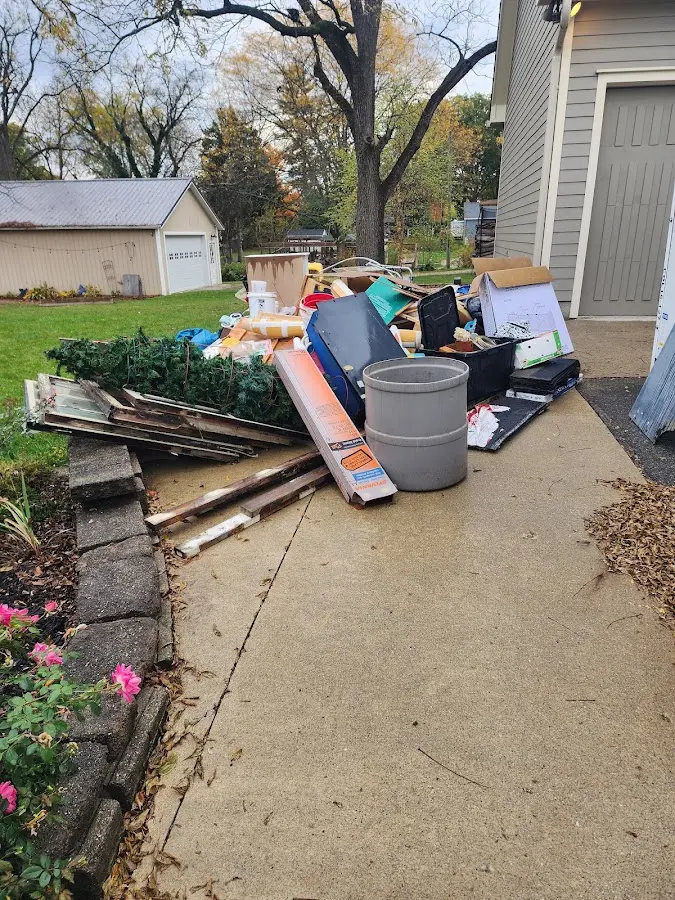 Dumpster being loaded with debris for 3 Yard Dumpster Rental in Santa Fe